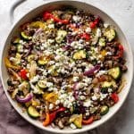 Served bowl of Mediterranean stir fry with ground beef and feta